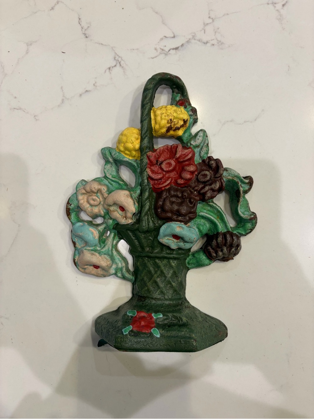 Vintage cast iron doorstop floral basket